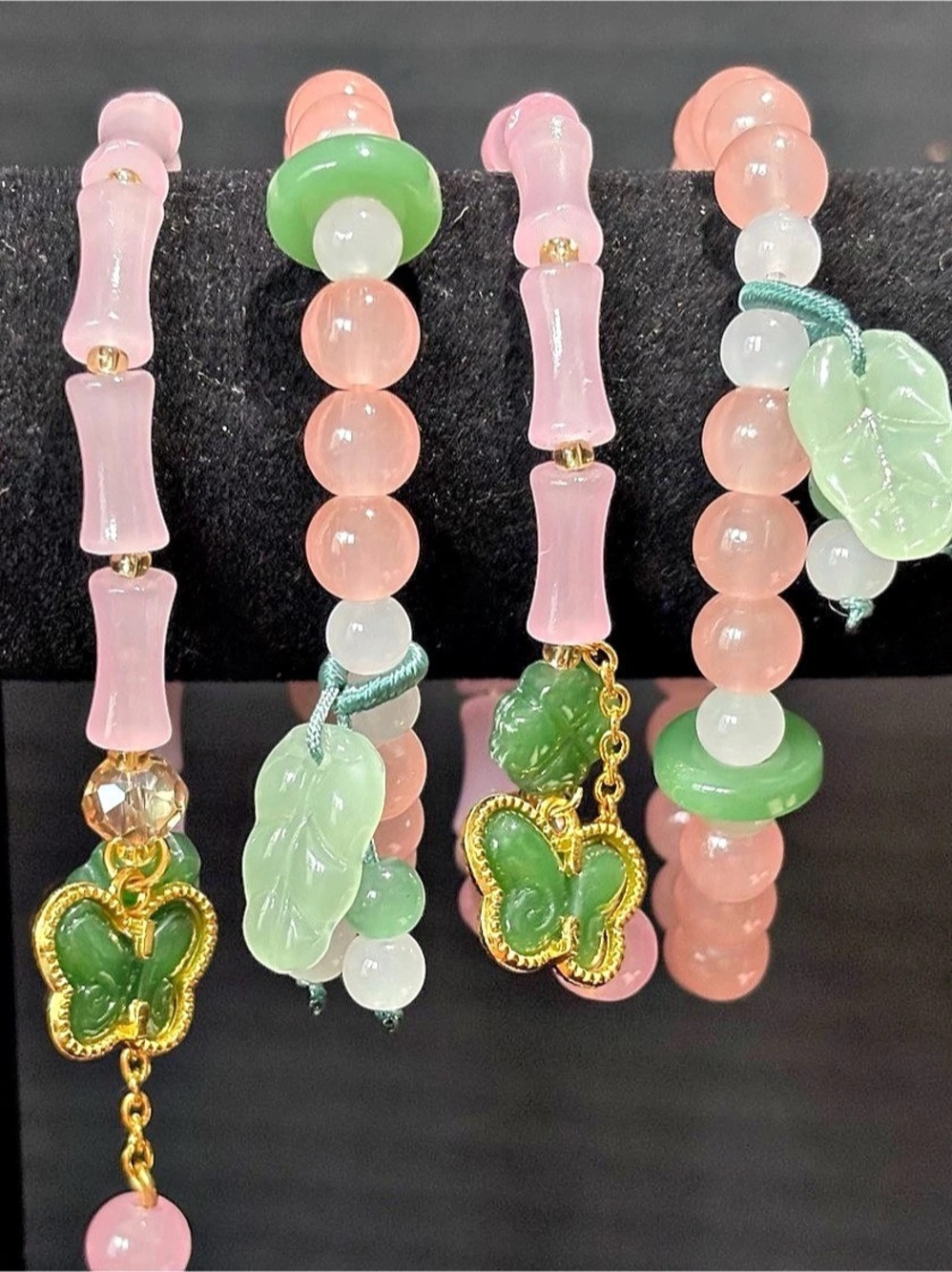 PINK & CORAL GLASS BAMBOO BEADED BRACELETS W/BUTTERFLY LEAF & PEACE CHARMS SET